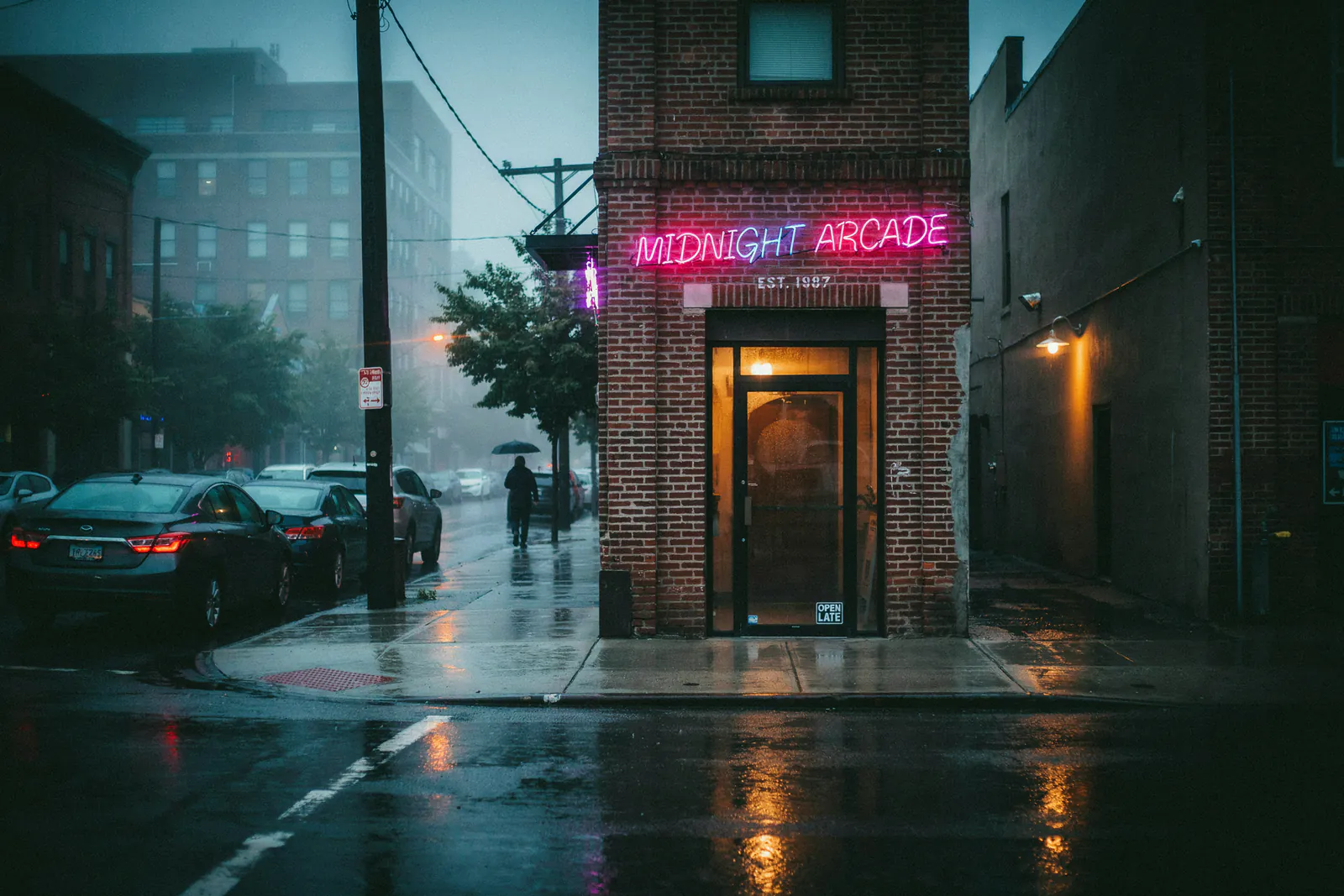 Ideogram v4 Quality photoreal night street with a magenta neon sign reading MIDNIGHT ARCADE on a rain-wet brick storefront